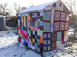 yarn_bomb_outhouse
